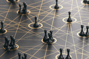 Game pieces on a game board connected by crisscrossing lines, symbolizing connections